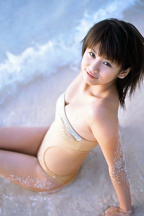 Beautiful gravure angel hanging out at the beach in her bikini