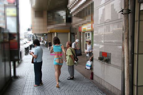 Japanese teen strips and shows her big booty and tits in a public place