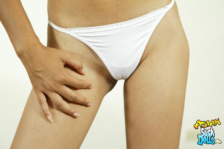 Slim brunette strips from white outfit