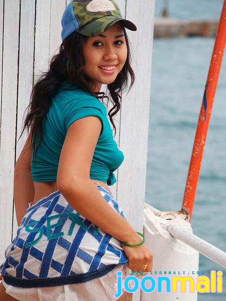 Teen cutie Joon Mali in a trucker cap and denim jean skirt