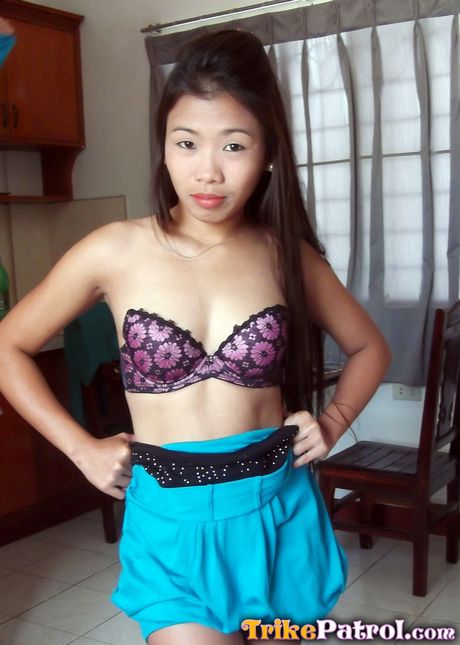 Asian teen Ashley strips and shows her tiny tits and shaved pussy