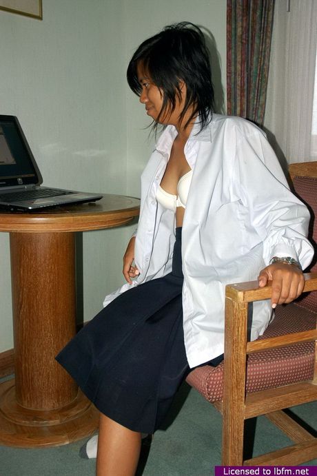 Asian amateur teen strips and unveils her tiny tits and pussy