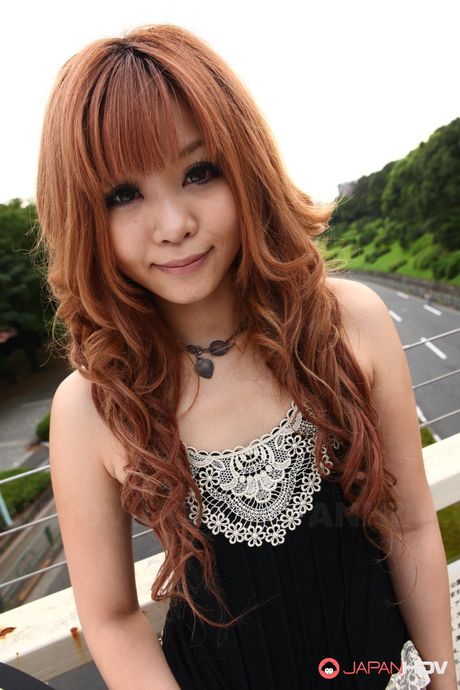 Shameless Sarina Tsubaki poses and exposes her creamy tits outdoors.