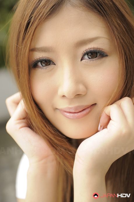 Caramel haired Uta Kohaku has fun before teasingly stripping.