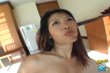 Asian teen Taew strips and shows her perfect tits and pussy