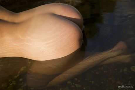 Sexy Asian babe Alana Jaya strips and rubs her pussy on the beach