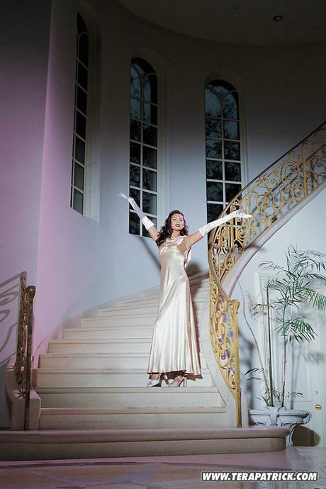 Alluring american redheaded milf Tera Patrick shows big knockers and spreads her legs